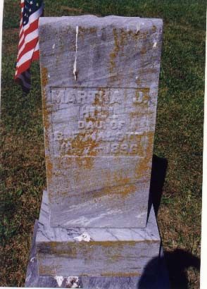 Weathered headstone reading Martha J. Hill, daughter of, partly illegible, died 1896