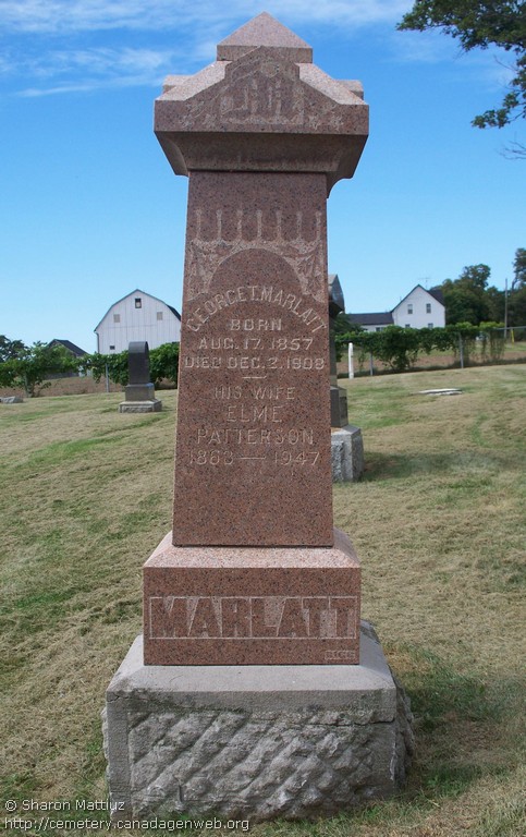 Tall red granite pillar reading George T. Marlatt born Aug 17 1857 died Dec 2 1908, his wife Elme Patterson 1863 to 1947, Marlatt