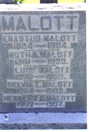 Family monument reading Malott, Erastus Malott 1854-1904, Ruth A. Malott 1861-1928, Lucy Malott 1896-1910, Selma Malott 1904-1905, Herbert Malott 1902-1907