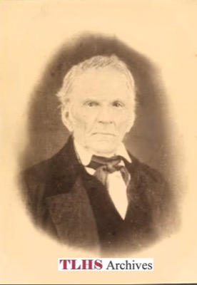 Oval sepia portrait of an elderly man with white hair, in a dark coat, white shirt and dark silk neck-cloth